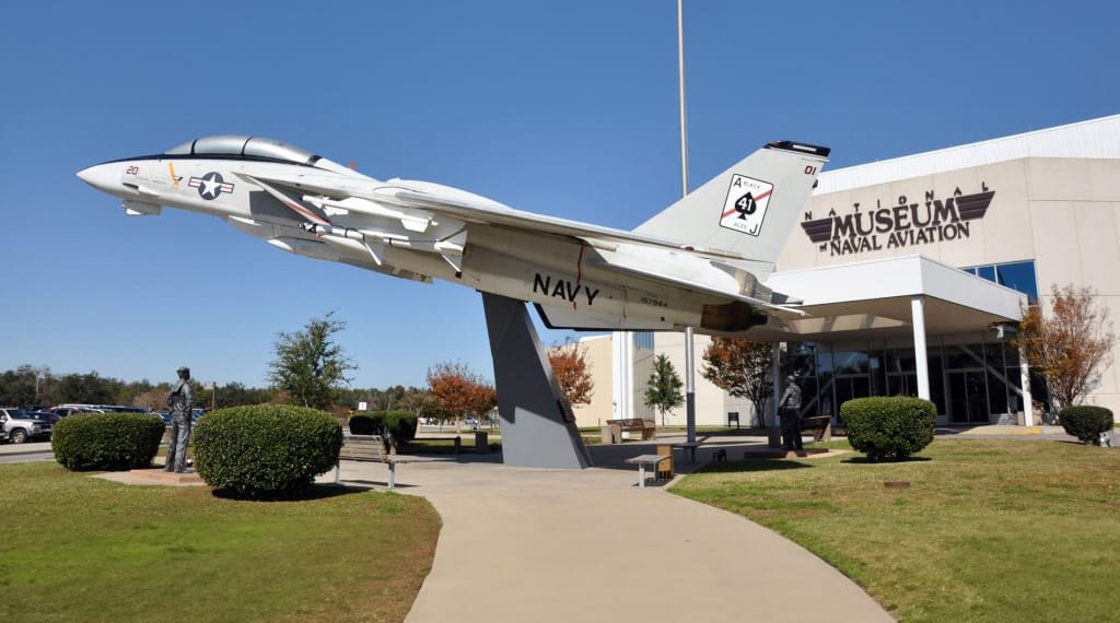 Navy fighter jet displayed at the entrance of the National Naval Aviation Museum